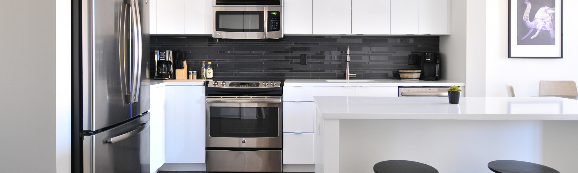 Information for sellers header image showing a white and stainless steel bright kitchen.